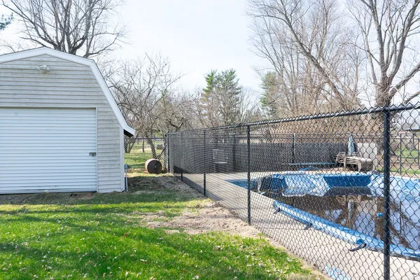 a view of a yard with a tree