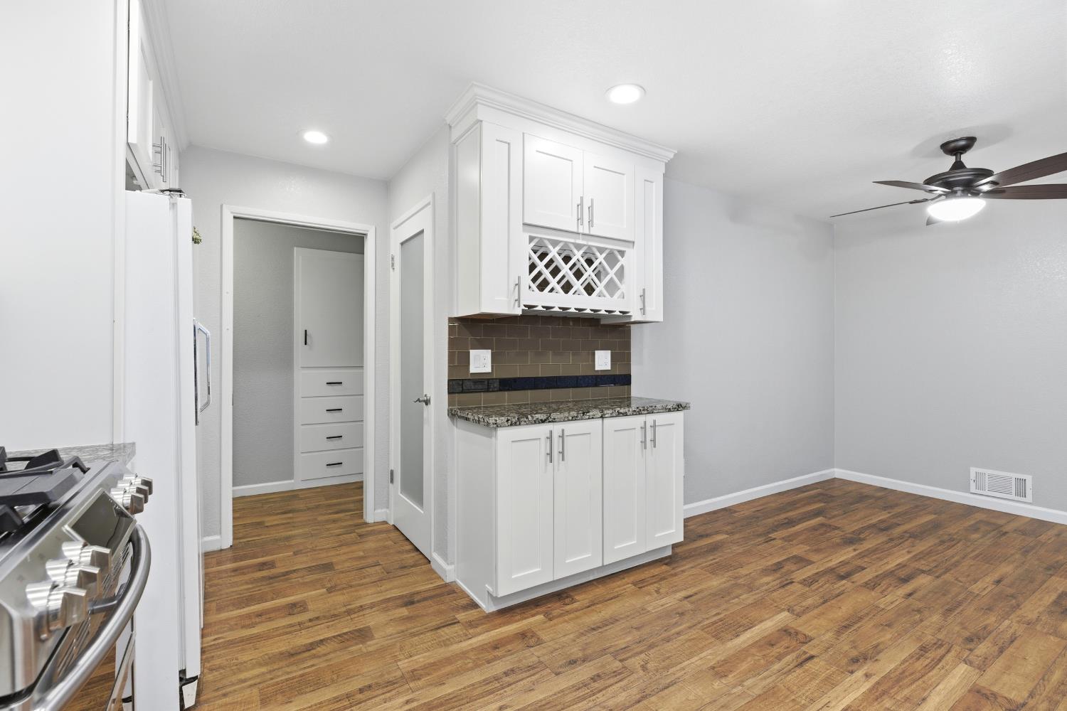 1416 Buttonwillow Drive Modesto, CA 95355 - Photo 11 of 39 a view of a livingroom with wooden floor