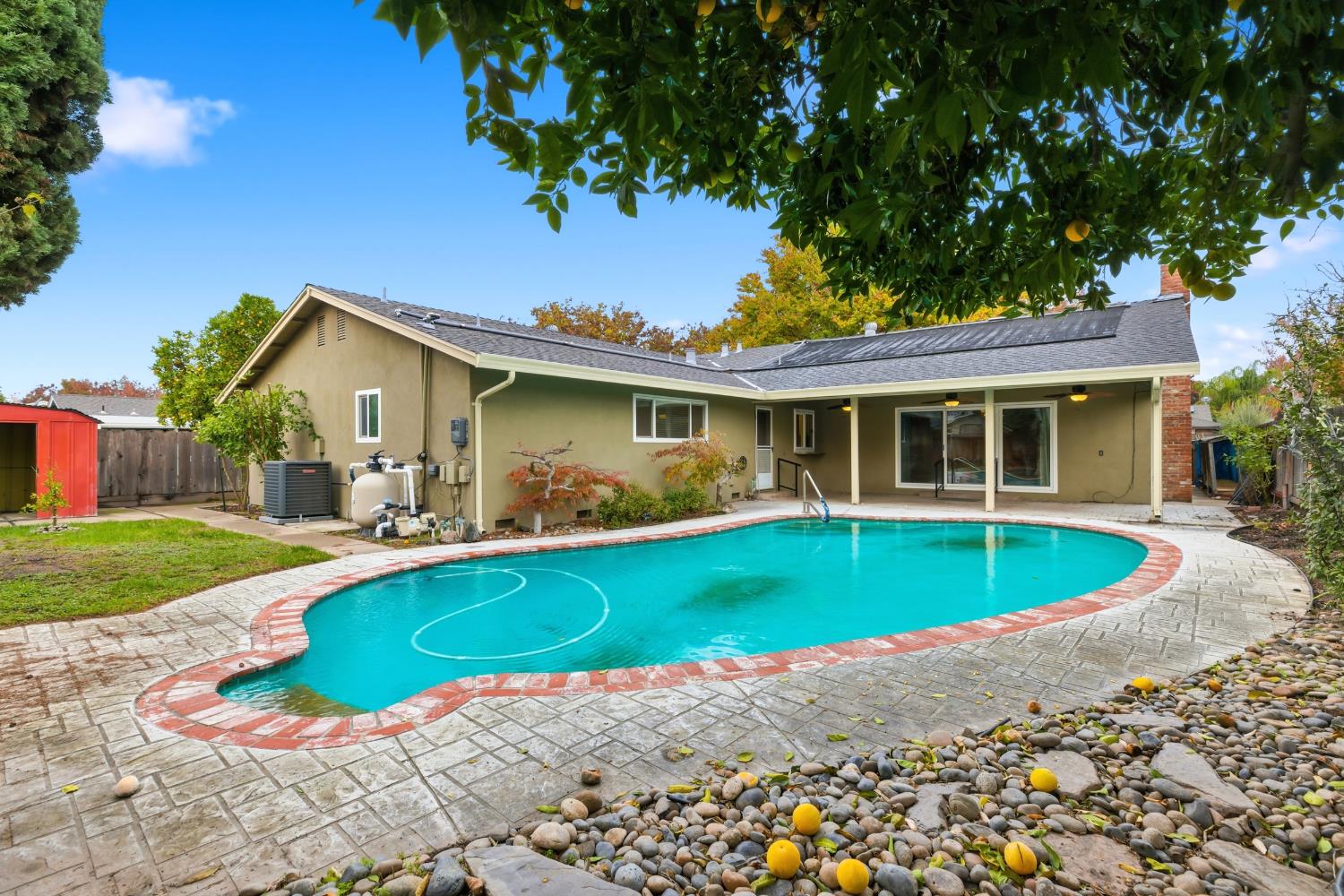 1416 Buttonwillow Drive Modesto, CA 95355 - Photo 28 of 39 a house with swimming pool in front of it