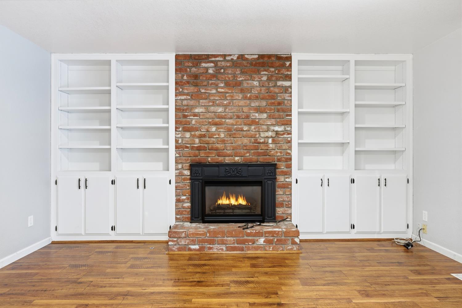 1416 Buttonwillow Drive Modesto, CA 95355 - Photo 5 of 39 a view of an empty room with a fireplace