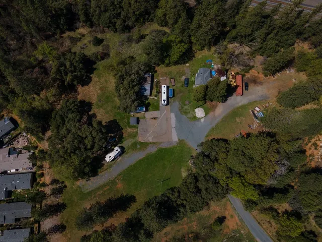 an aerial view of residential house with outdoor space