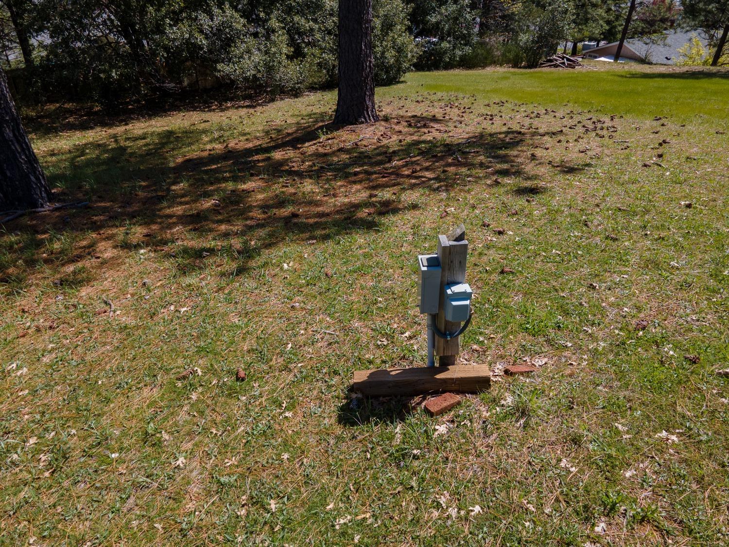 155 Whitcomb Avenue Colfax, CA 95713 - Photo 30 of 30 a backyard of a house with a yard and lake view