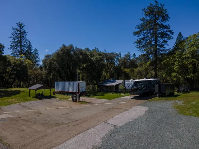 a view of swimming pool with outdoor seating and yard