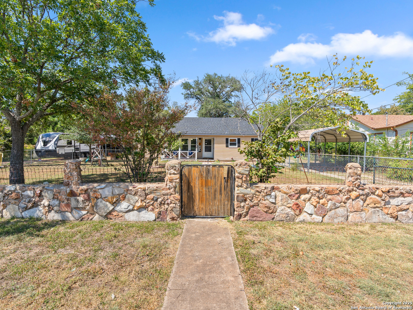 608 Ross Street Kerrville, TX 78028 - Photo 1 of 24 a front view of a house with garden