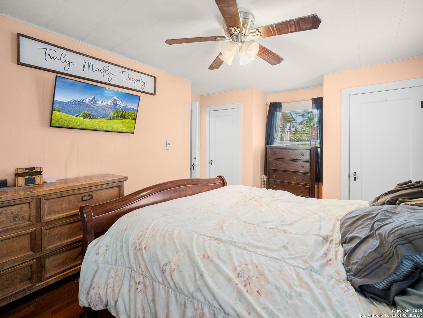 608 Ross Street Kerrville, TX 78028 - Photo 12 of 24 a bedroom with a bed and a dresser