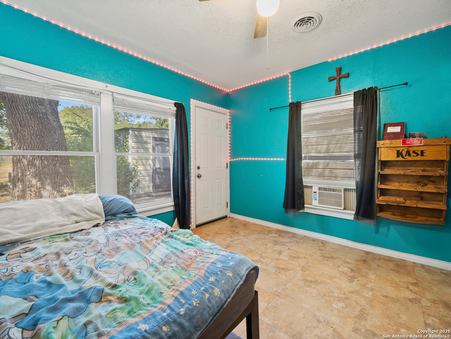 608 Ross Street Kerrville, TX 78028 - Photo 15 of 24 a bedroom with a bed and a window