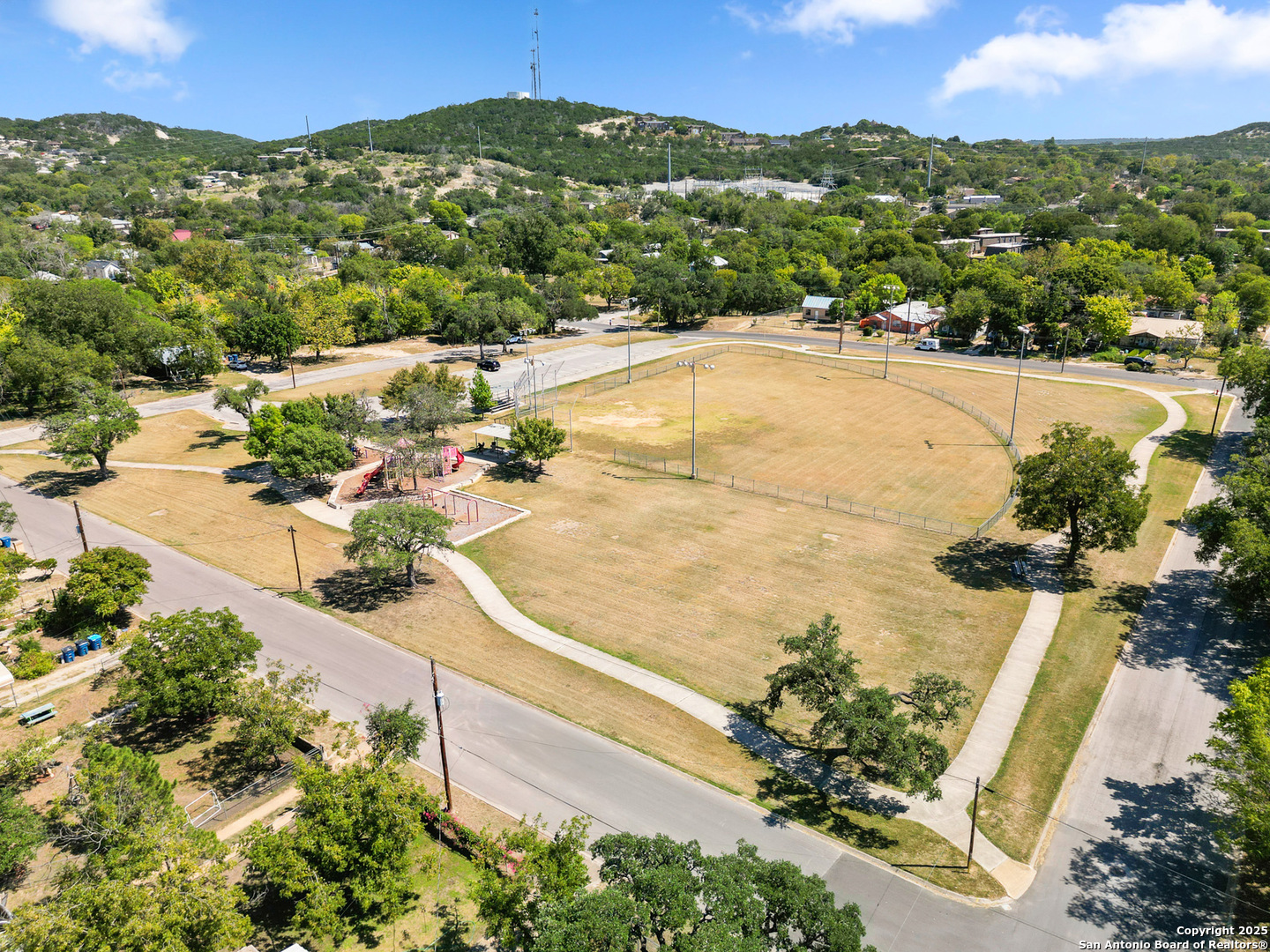 608 Ross Street Kerrville, TX 78028 - Photo 19 of 24 an aerial view of residential houses with outdoor space and trees