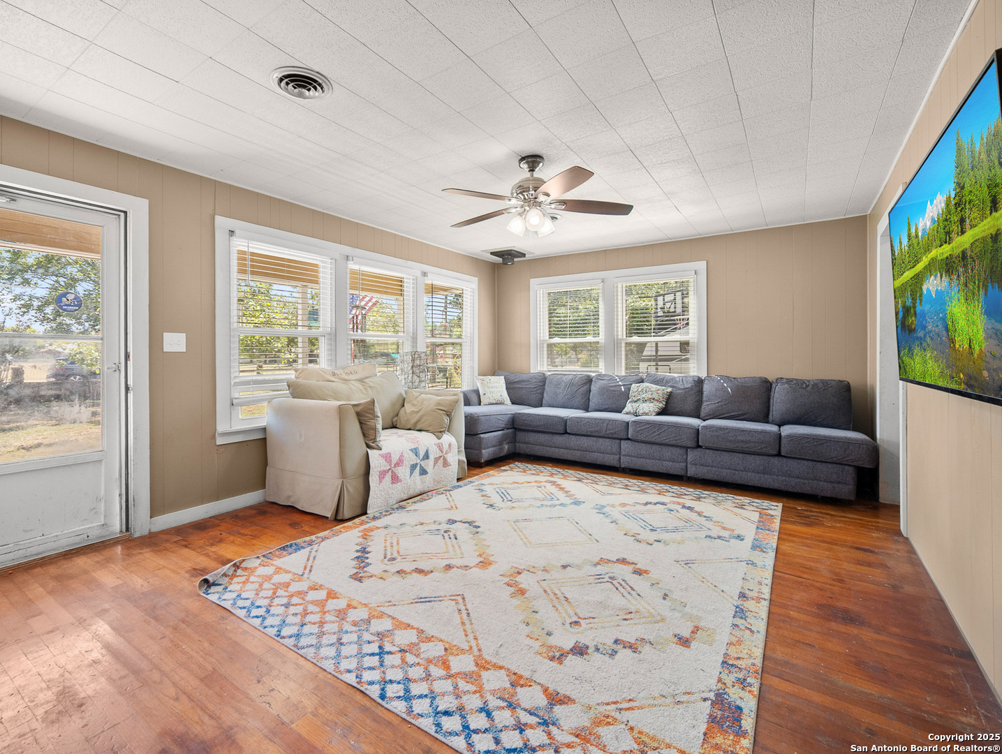 608 Ross Street Kerrville, TX 78028 - Photo 2 of 24 a living room with furniture and a large window