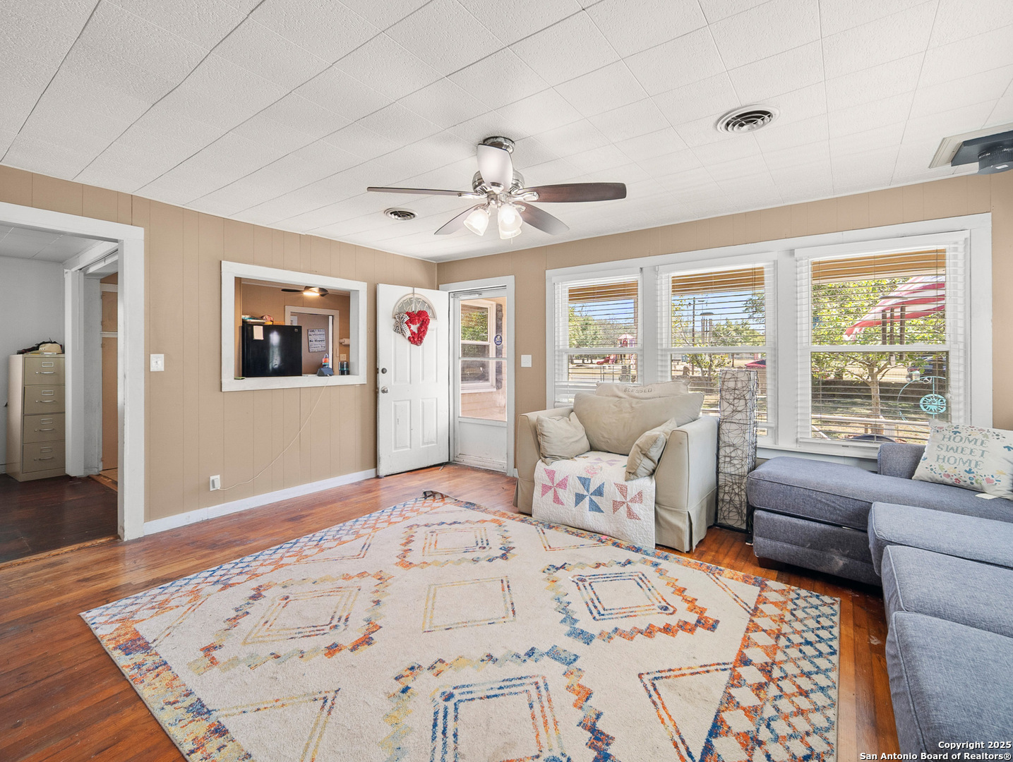 608 Ross Street Kerrville, TX 78028 - Photo 3 of 24 a bedroom with furniture and a large window