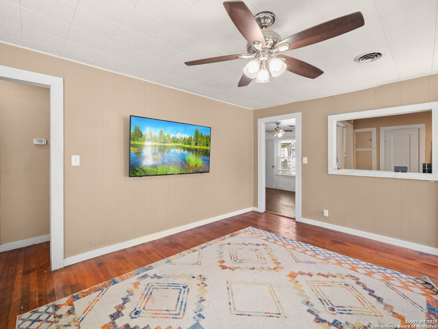 608 Ross Street Kerrville, TX 78028 - Photo 5 of 24 a bedroom with bed and wooden floor