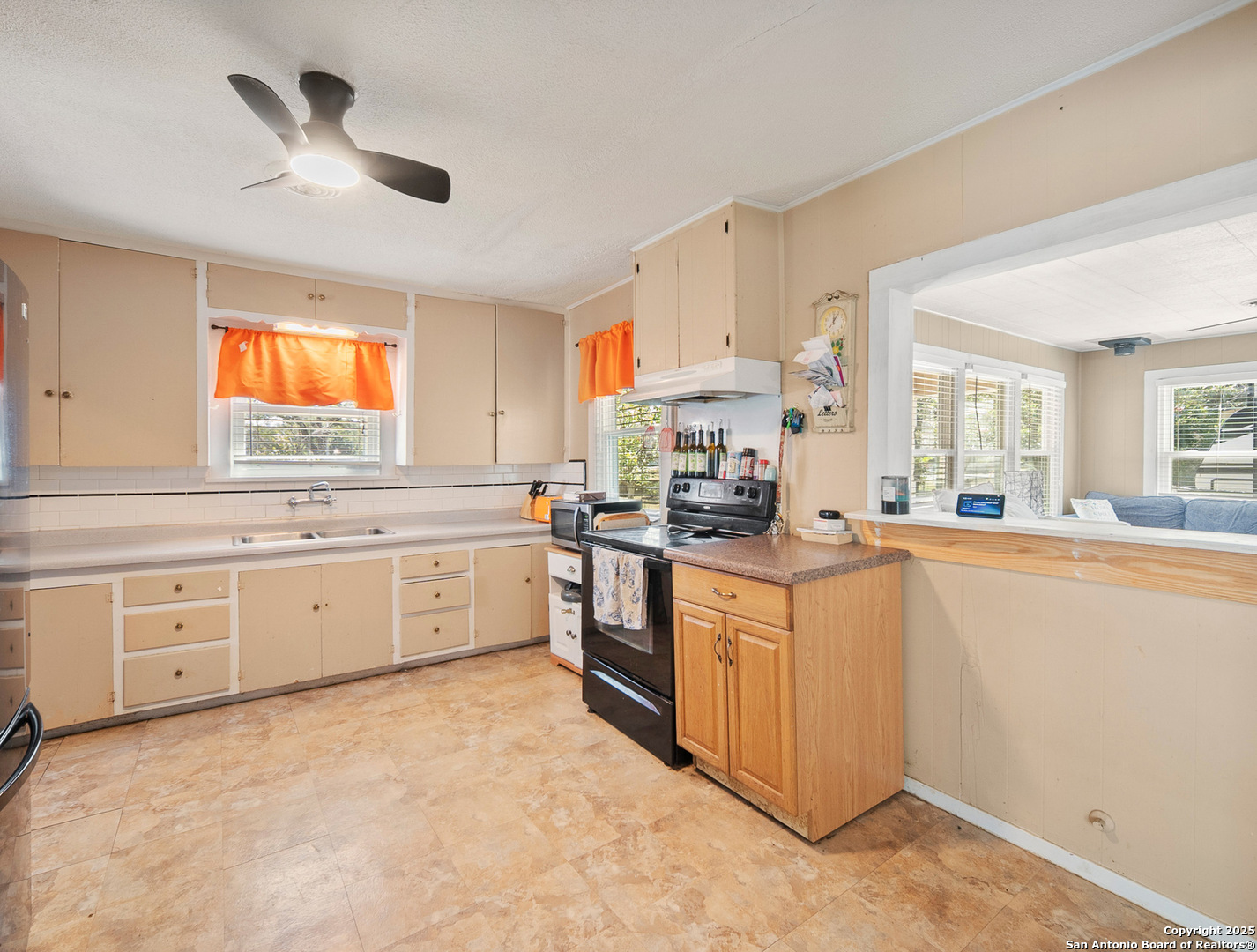 608 Ross Street Kerrville, TX 78028 - Photo 6 of 24 a kitchen with white cabinets and white appliances