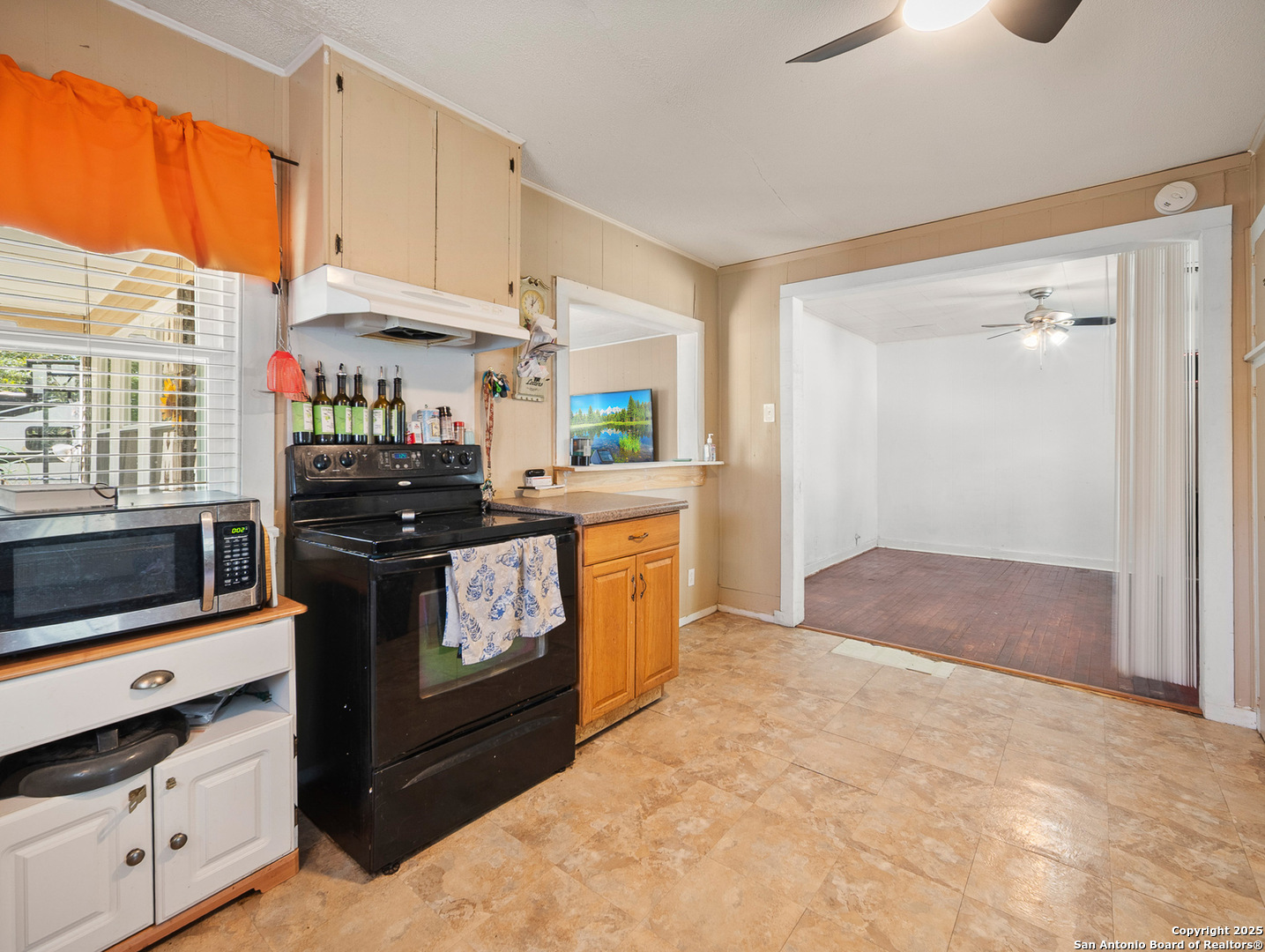 608 Ross Street Kerrville, TX 78028 - Photo 8 of 24 a kitchen with a stove and a refrigerator