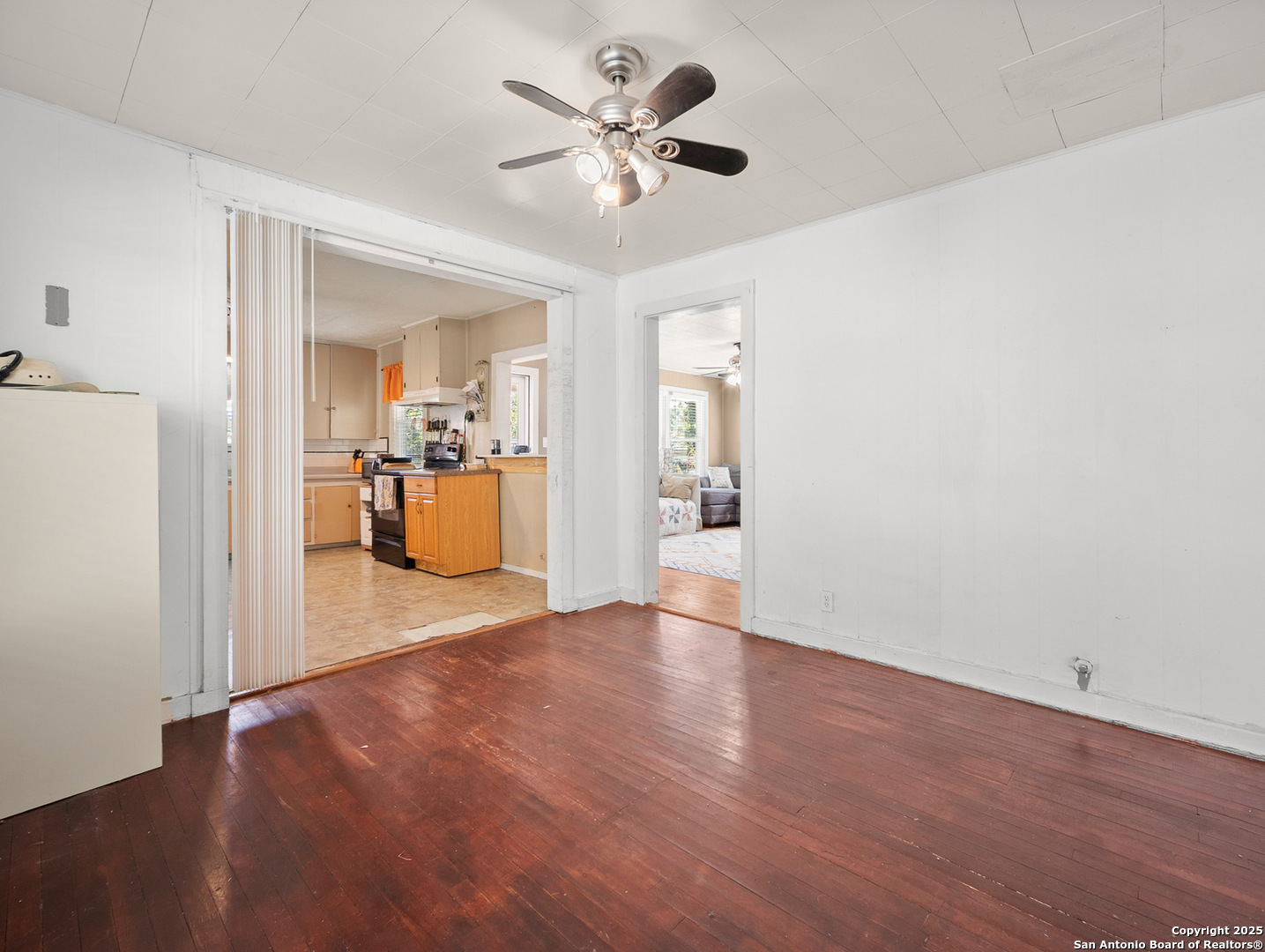608 Ross Street Kerrville, TX 78028 - Photo 10 of 24 a view of a kitchen with a sink and a refrigerator