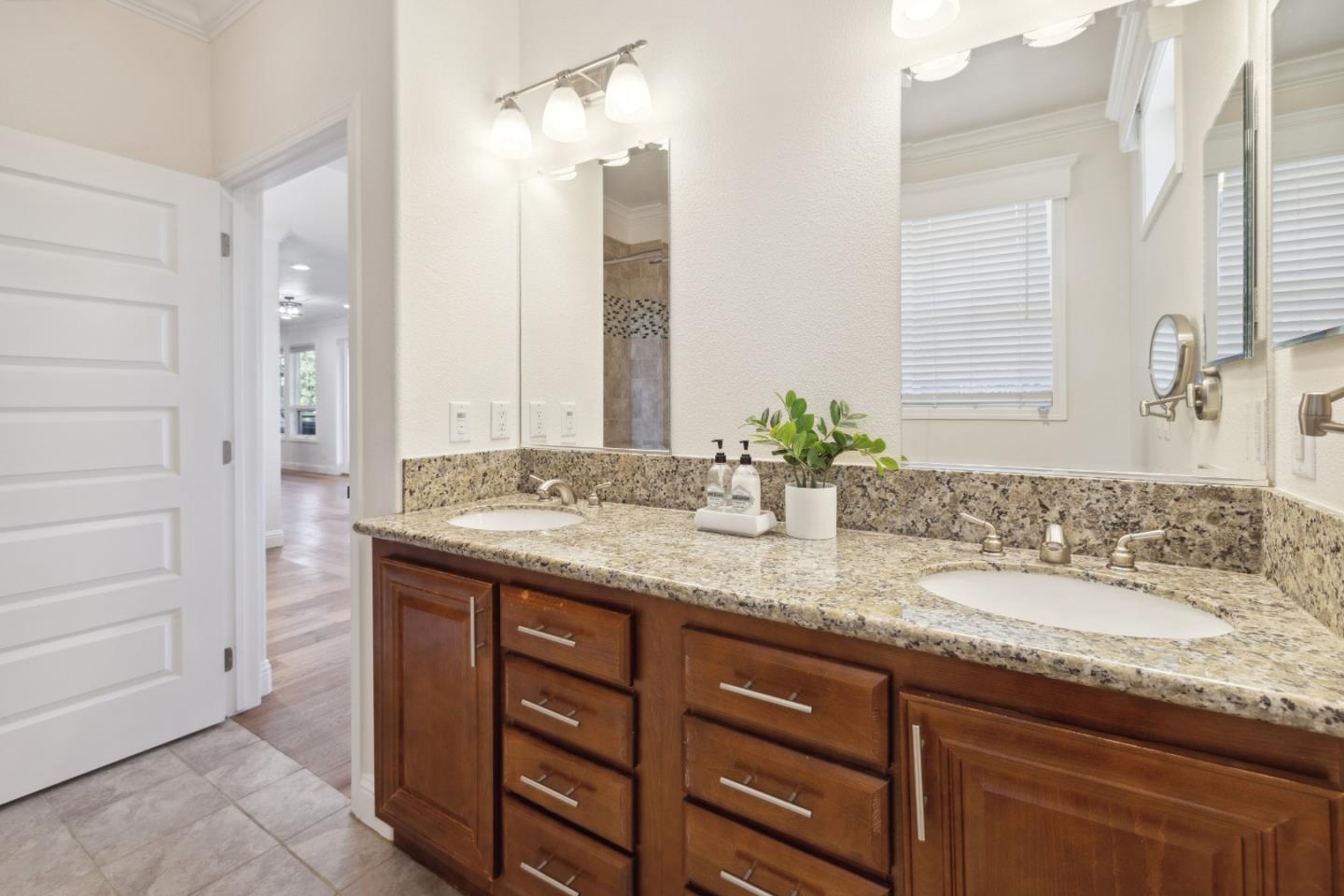 24475 Mountain Charlie Road Los Gatos, CA 95033 - Photo 12 of 69 a bathroom with a granite countertop sink and a mirror