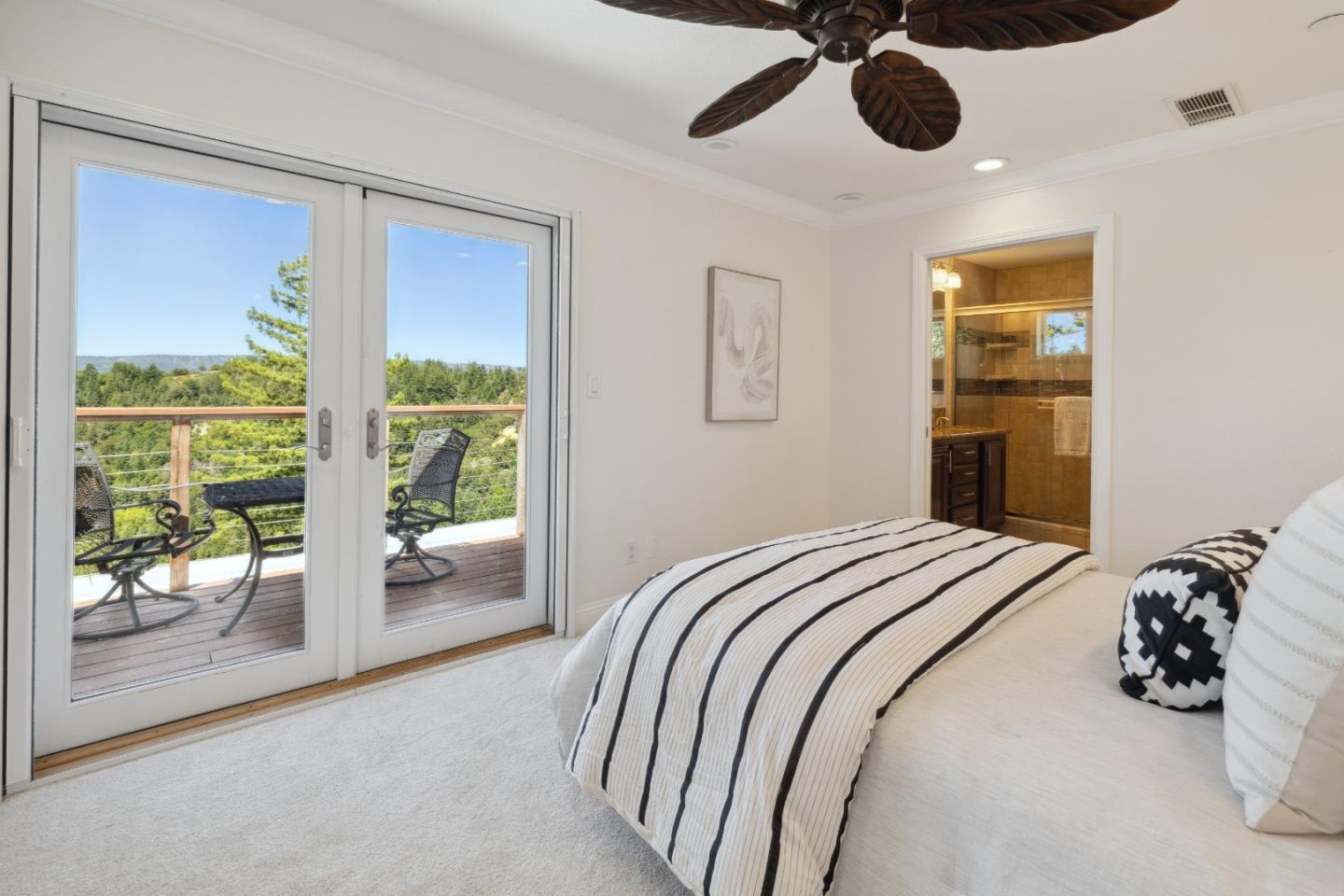 24475 Mountain Charlie Road Los Gatos, CA 95033 - Photo 18 of 69 a bedroom with a bed and a large window