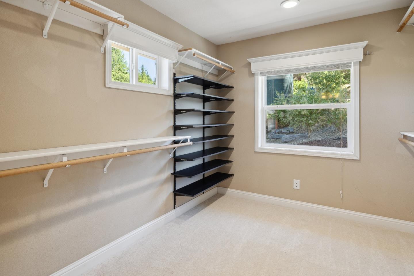 24475 Mountain Charlie Road Los Gatos, CA 95033 - Photo 20 of 69 a view of walk in closet with empty racks