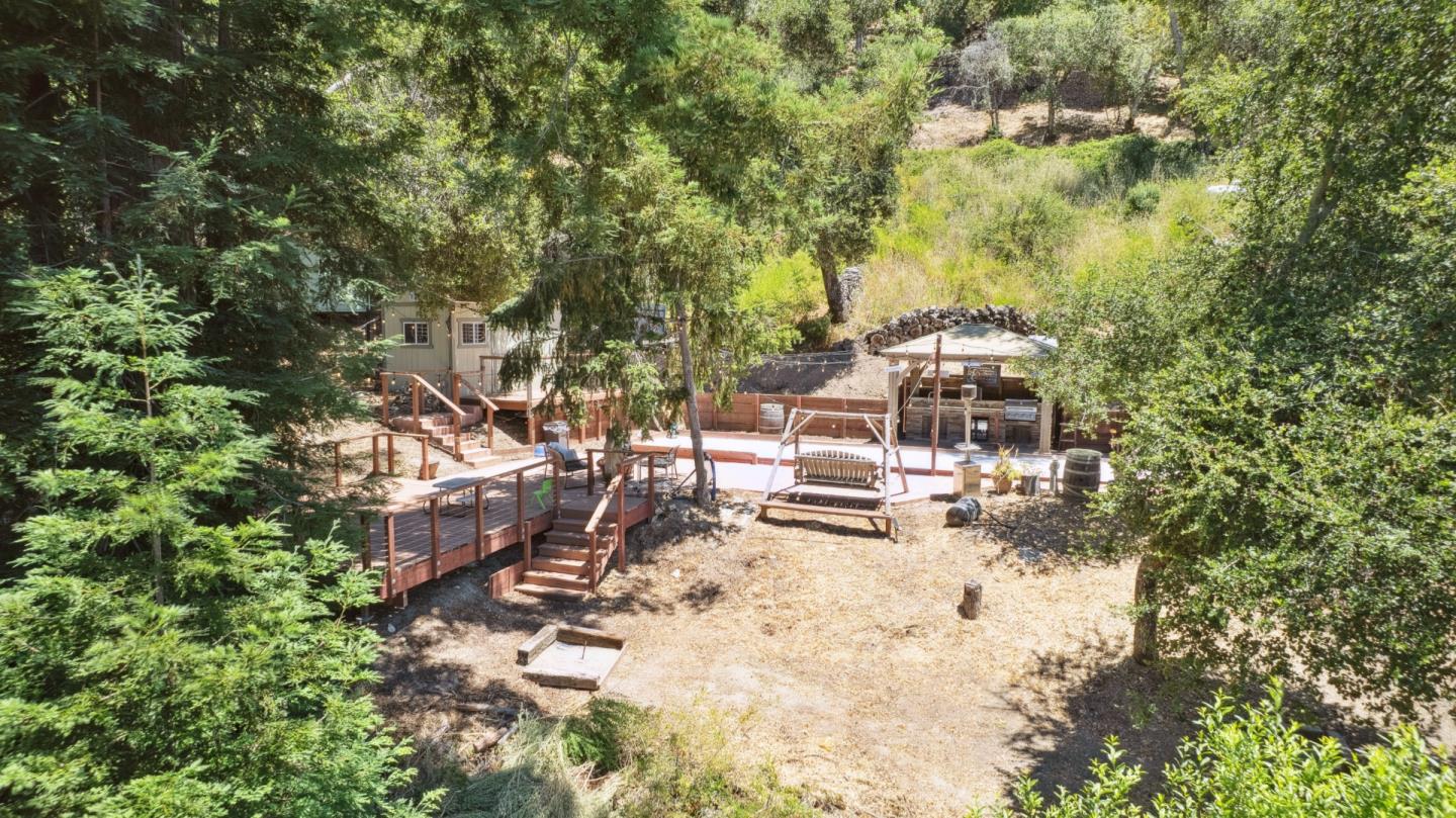 24475 Mountain Charlie Road Los Gatos, CA 95033 - Photo 37 of 69 a view of yard with outdoor seating and trees