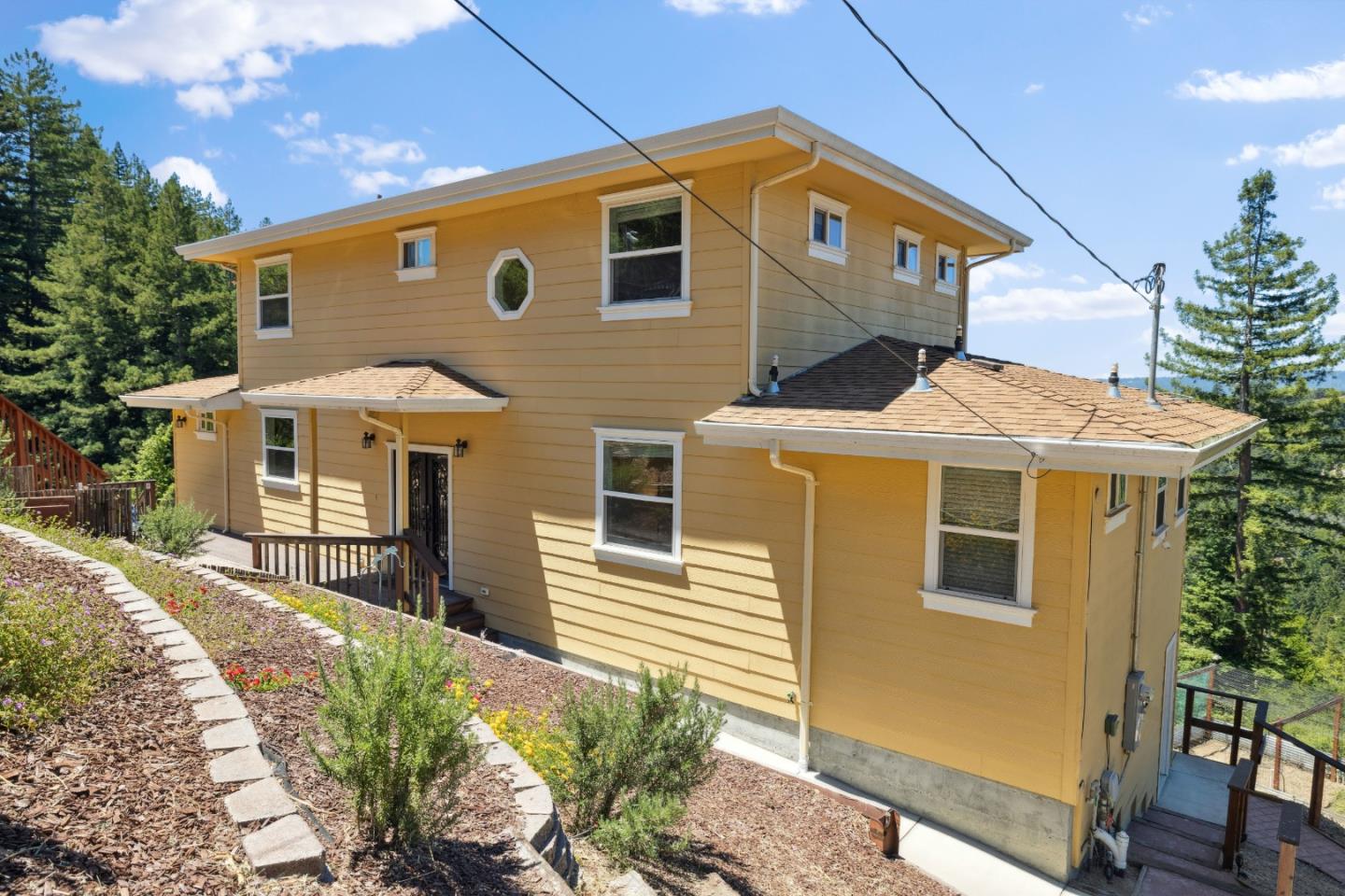 24475 Mountain Charlie Road Los Gatos, CA 95033 - Photo 47 of 69 a front view of a house with a yard