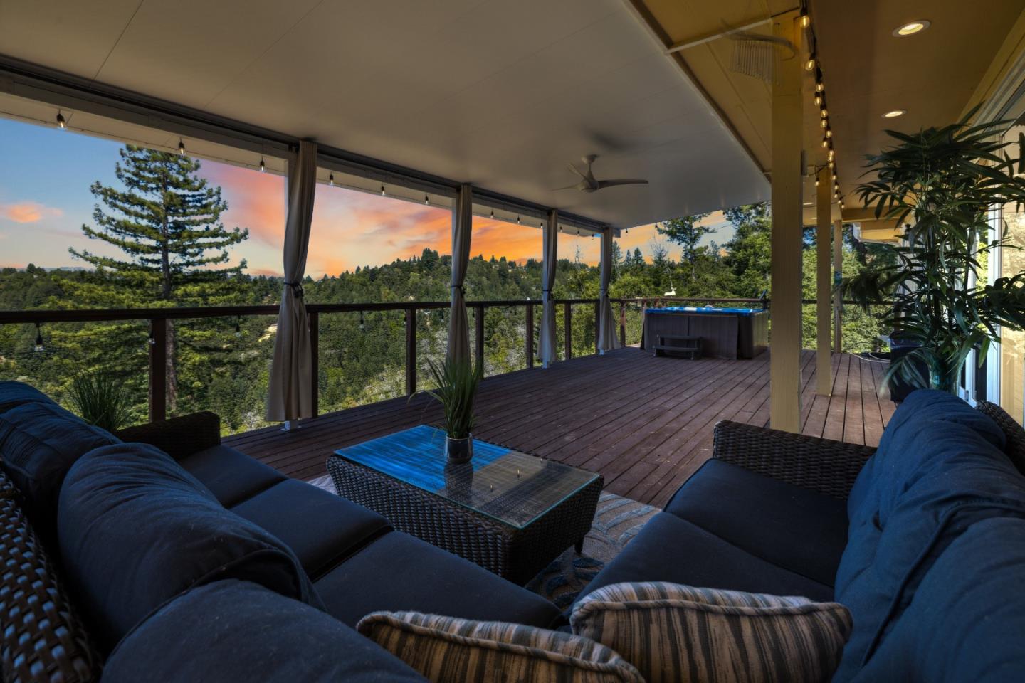 24475 Mountain Charlie Road Los Gatos, CA 95033 - Photo 55 of 69 a living room with furniture tv and a large window