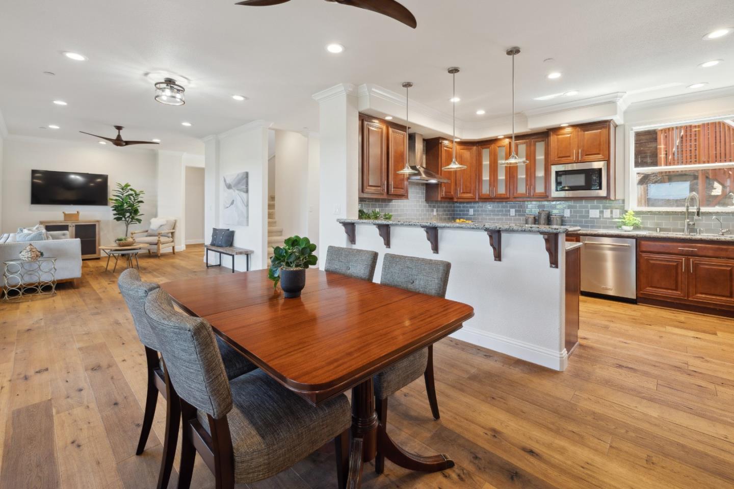 24475 Mountain Charlie Road Los Gatos, CA 95033 - Photo 6 of 69 a view of a dining room with furniture and wooden floor