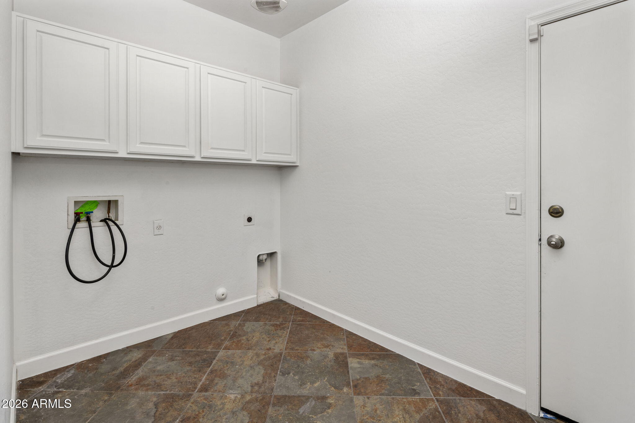 5121 West Beverly Road Laveen, AZ 85339 - Photo 23 of 32 a view or white cabinets and washer