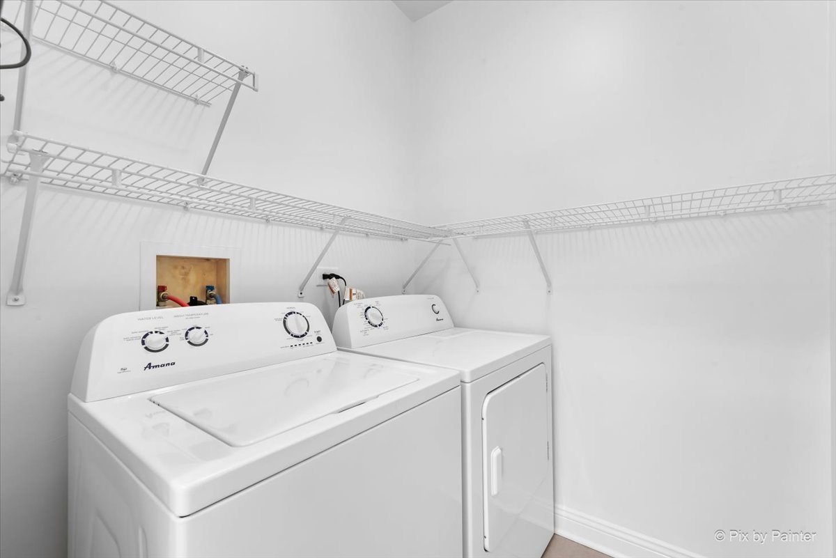 827 Riding Lane, Unit 827 St. Charles, IL 60174 - Photo 17 of 40 a utility room with dryer and washer