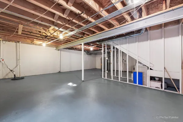 a view of an empty room with stairs