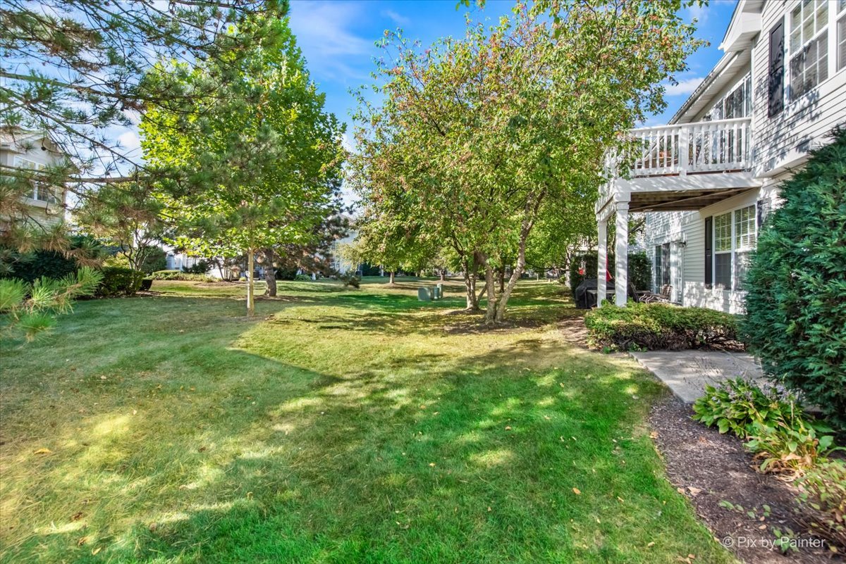 827 Riding Lane, Unit 827 St. Charles, IL 60174 - Photo 32 of 40 a view of a house with a yard