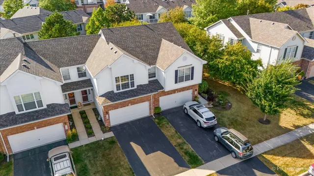 aerial view of a house with backyard