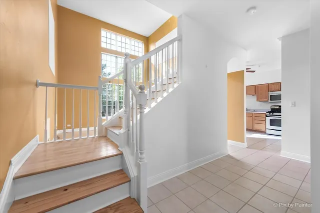 a view of an entryway with wooden floor and door
