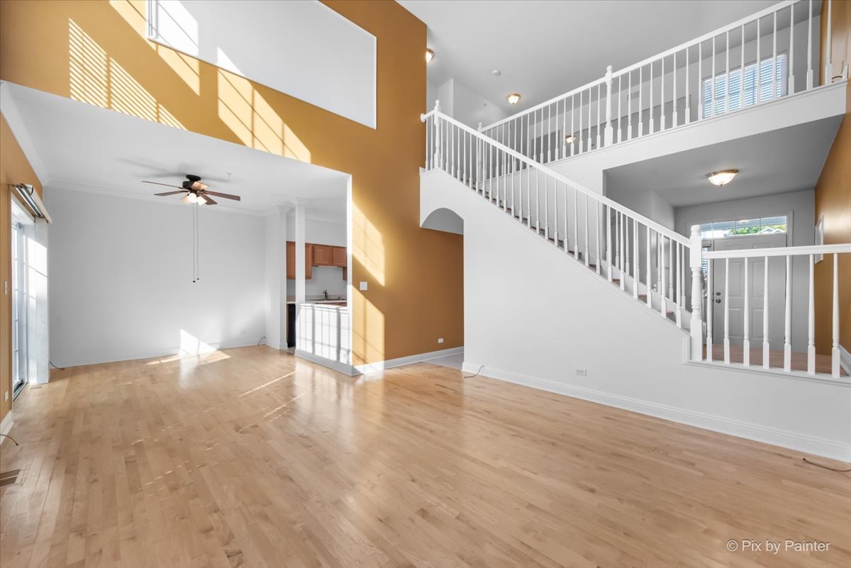 827 Riding Lane, Unit 827 St. Charles, IL 60174 - Photo 6 of 40 a view of an entryway with wooden floor