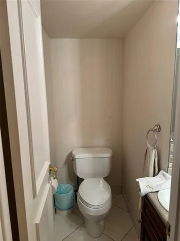 a bedroom with a bed and glass window