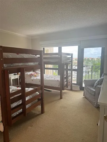 a bedroom with a bed and a chair