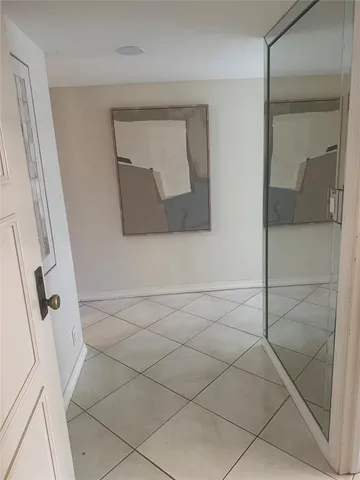 a lobby with furniture and window