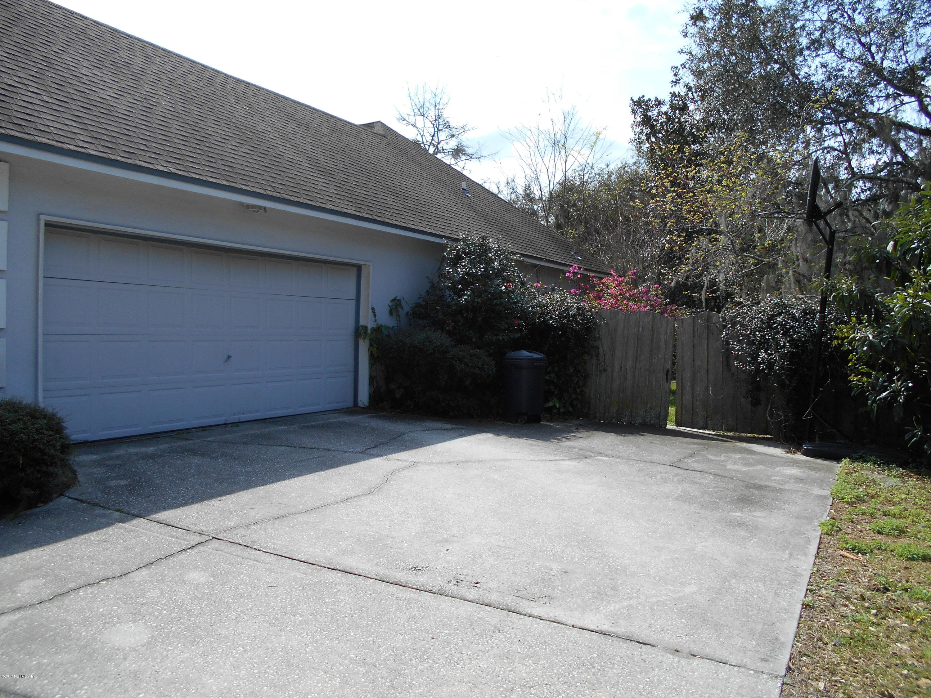 3006 Holly Road Orange Park, FL 32065 - Photo 16 of 19 a house with trees in front of it