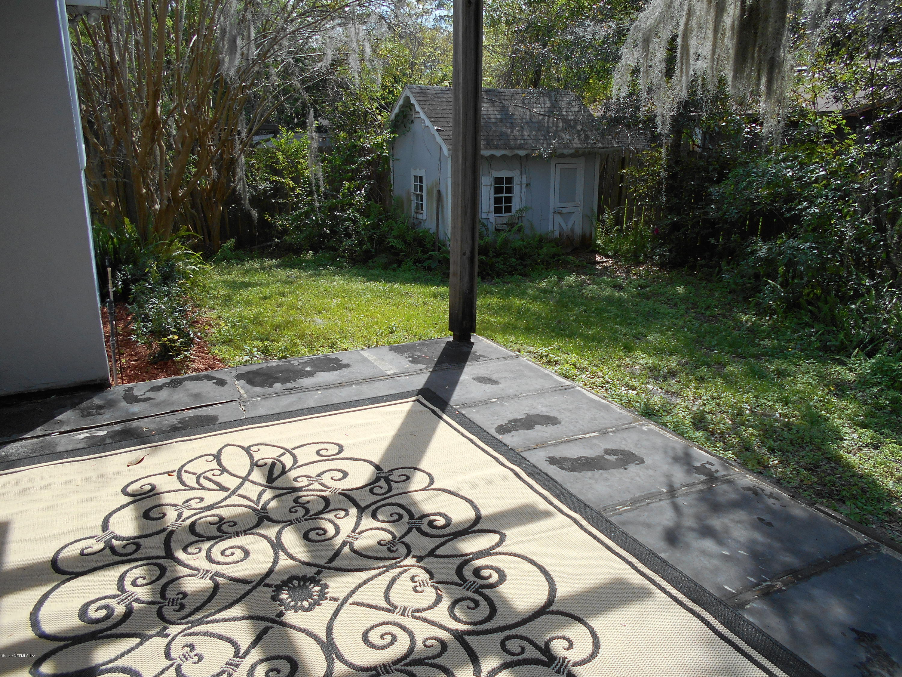 3006 Holly Road Orange Park, FL 32065 - Photo 19 of 19 a view of a backyard with large trees and plants