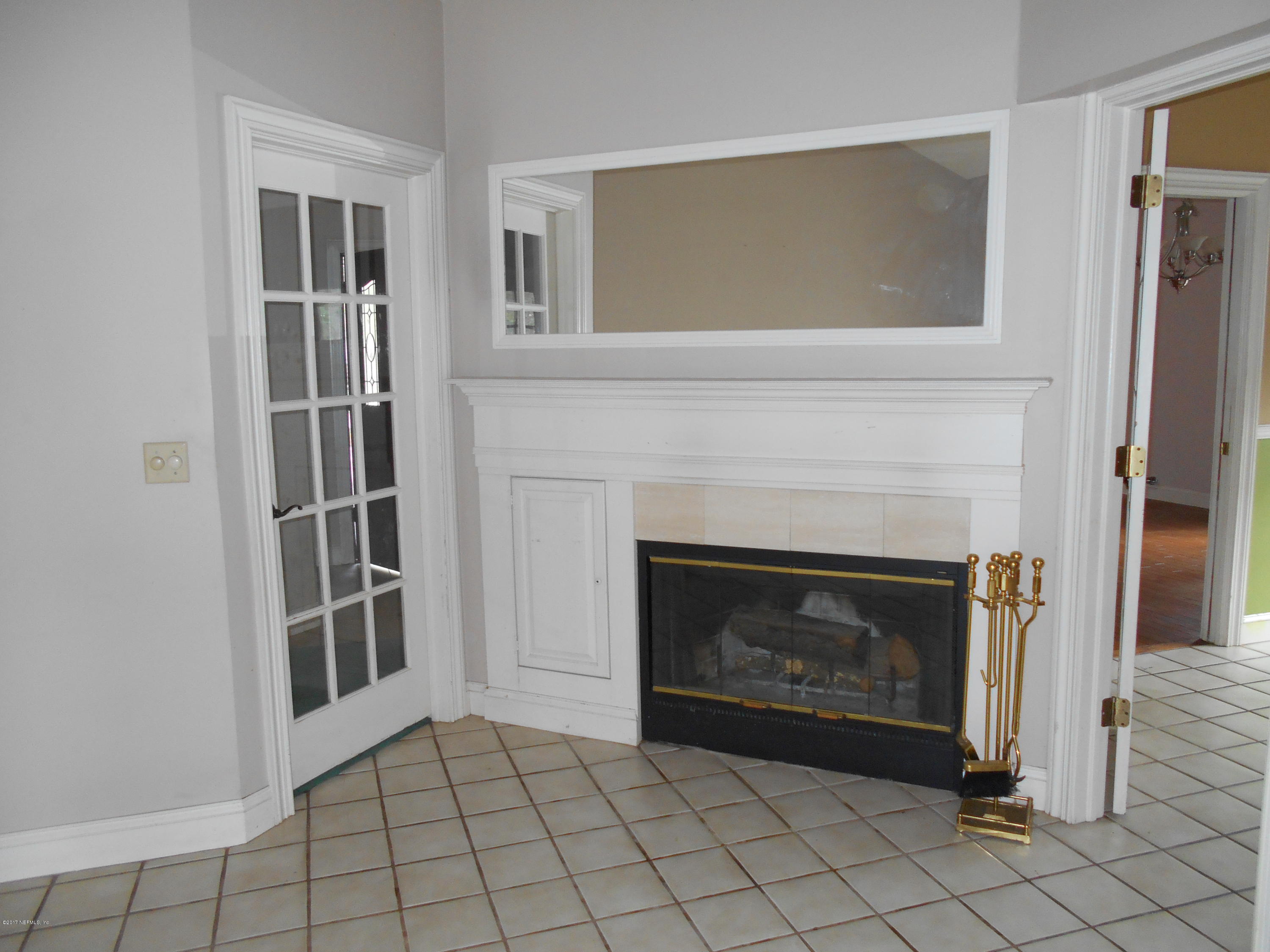 3006 Holly Road Orange Park, FL 32065 - Photo 10 of 19 a view of an empty room with fire place and fire place
