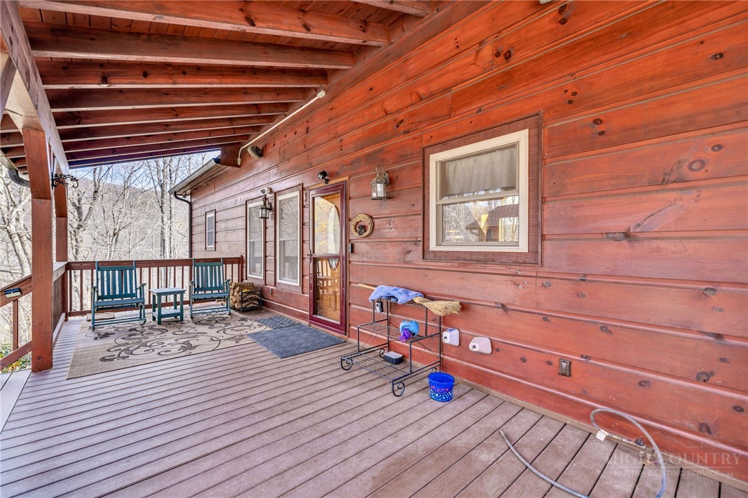 7994 3 Top Road Todd, NC 28684 - Photo 40 of 50 a view of a porch with wooden floor and iron stairs
