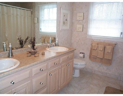 958 Salem End Road Framingham, MA 01702 - Photo 11 of 22 a bathroom with a double vanity sink toilet and a mirror