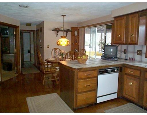 958 Salem End Road Framingham, MA 01702 - Photo 14 of 22 a kitchen with a sink cabinets and window