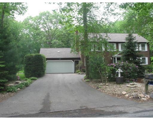 958 Salem End Road Framingham, MA 01702 - Photo 21 of 22 a front view of a house with a yard and garage