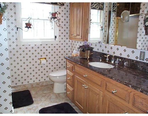 958 Salem End Road Framingham, MA 01702 - Photo 8 of 22 a bathroom with a double vanity sink toilet and mirror