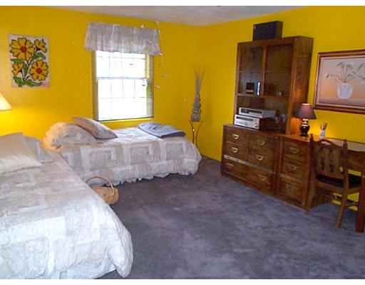 958 Salem End Road Framingham, MA 01702 - Photo 9 of 22 a bedroom with a bed and dresser