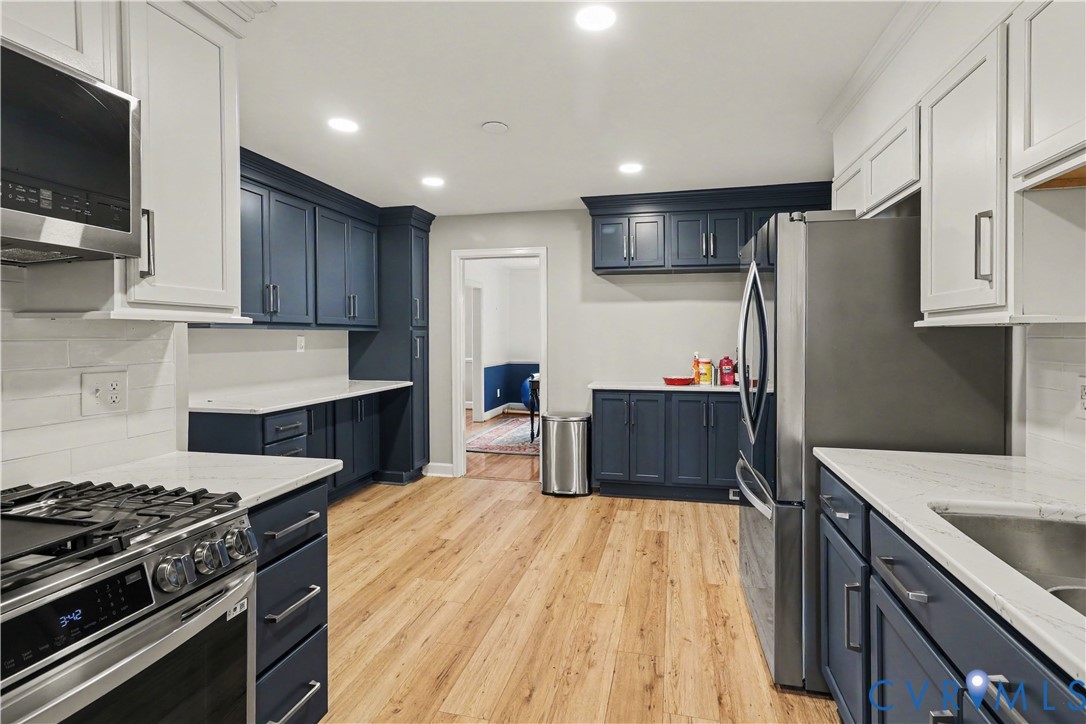 4803 Coleman Road Richmond, VA 23230 - Photo 15 of 54 Kitchen featuring two-tone cabinetry, stainless st