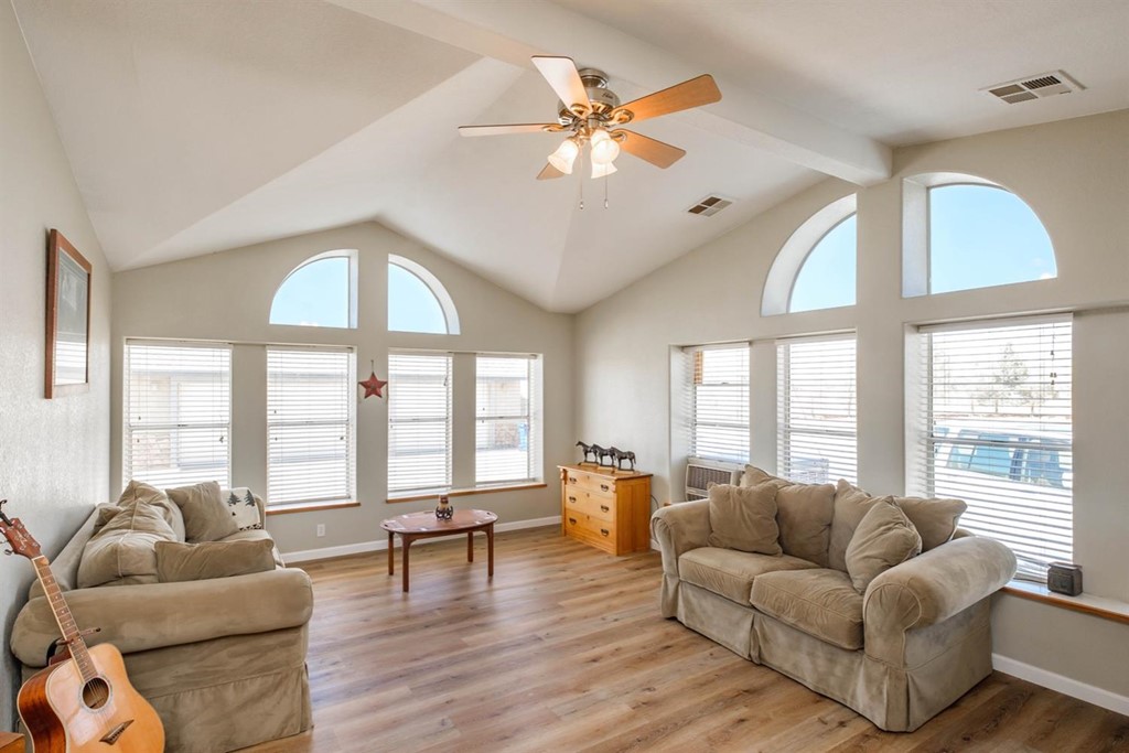 14554 Natoma Road Apple Valley, CA 92307 - Photo 1 of 1 a living room with furniture and a large window
