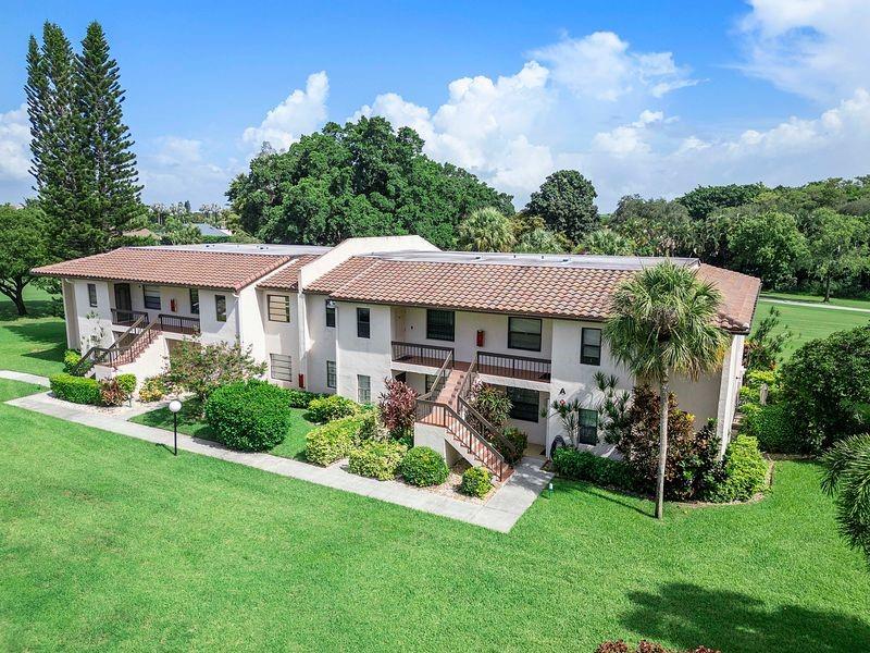 a front view of a house with a yard table and chairs