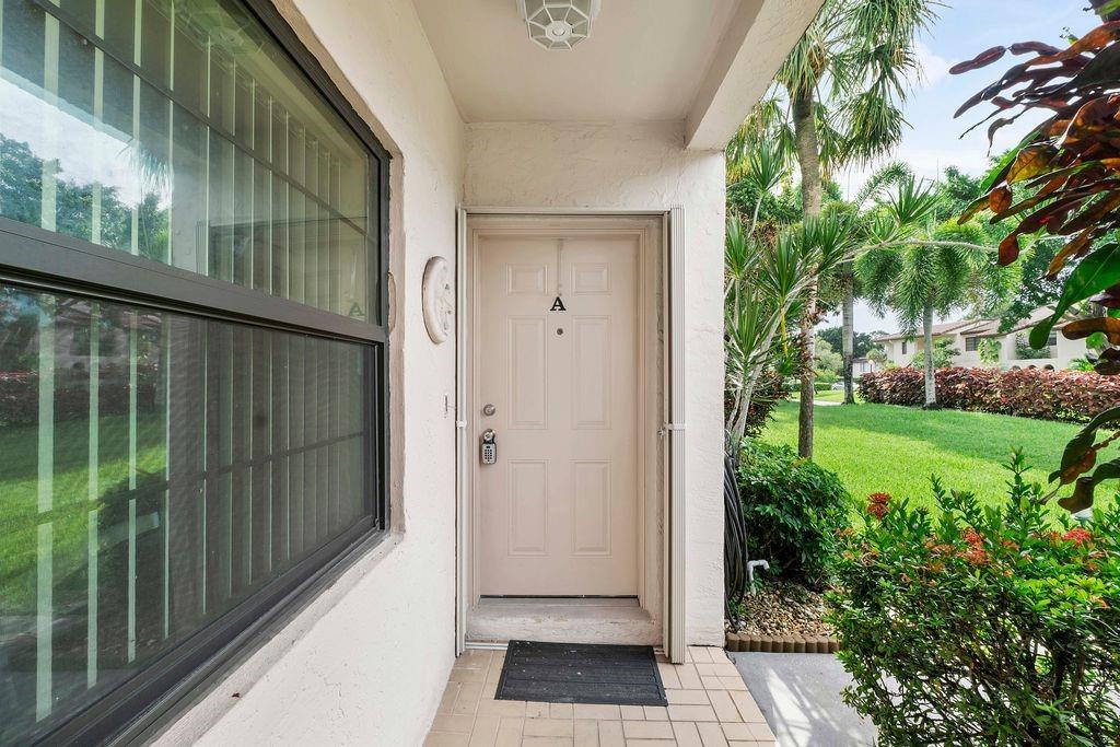21452 Juego Circle, Unit 31A Boca Raton, FL 33433 - Photo 6 of 38 a view of a entrance