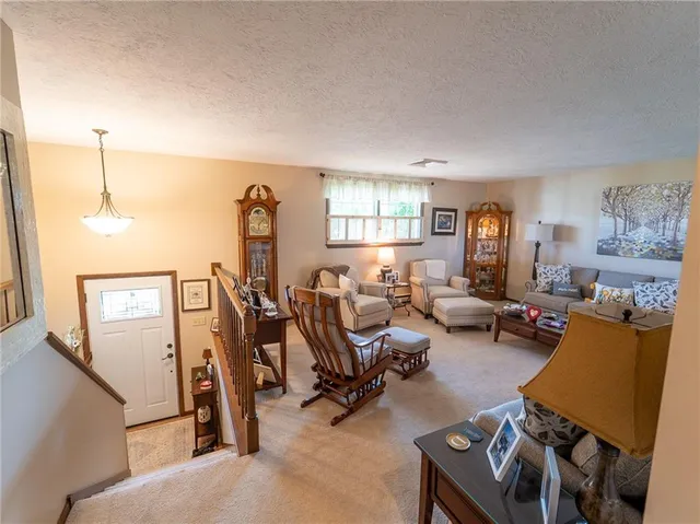 a view of a livingroom with furniture and a window