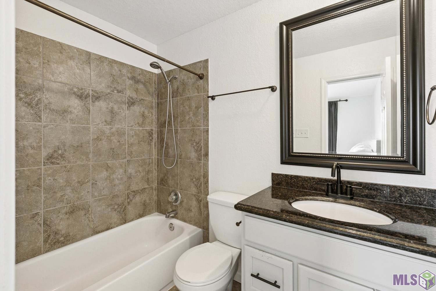 10302 West Winston Avenue, Unit 11 Baton Rouge, LA 70809 - Photo 10 of 18 Second full bathroom