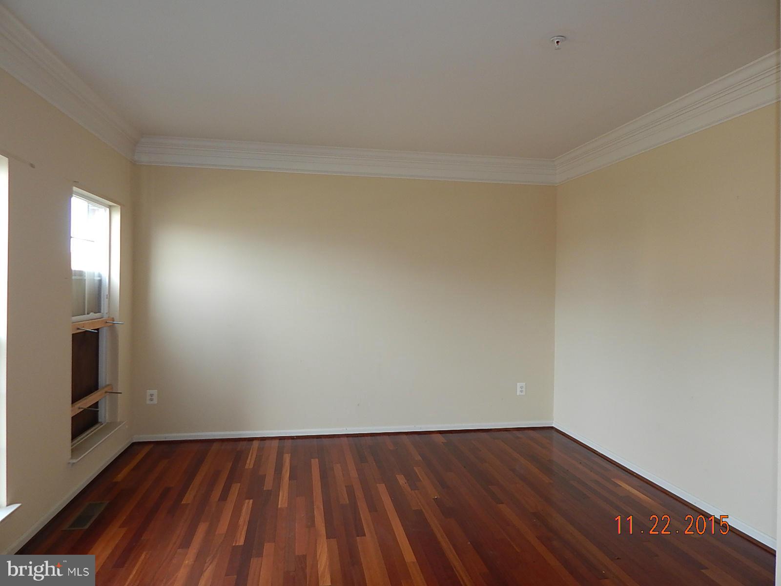 14411 Autumn Rust Road Boyds, MD 20841 - Photo 2 of 30 a view of an empty room and wooden floor